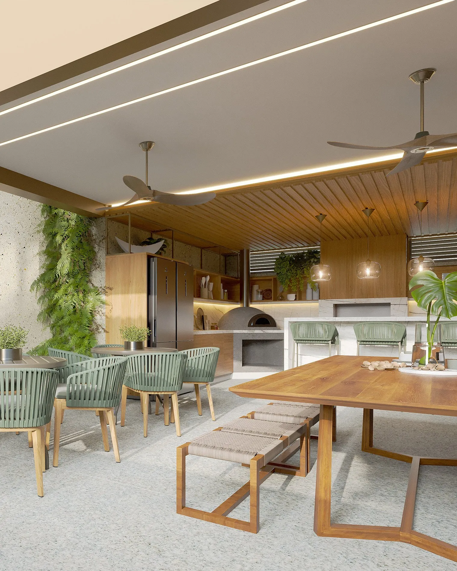 Espaço gourmet do Mon Trésor Vila Ema, com mesa de madeira, cadeiras verdes e forno de pizza
