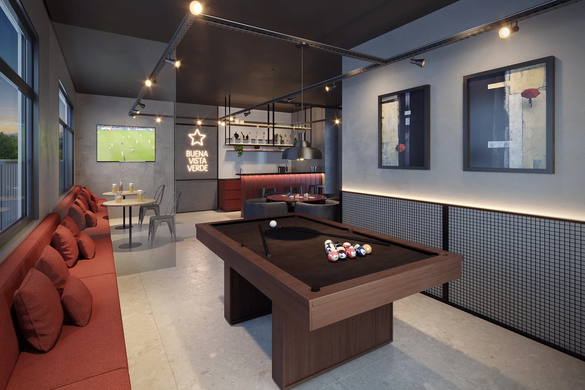 Salão de jogos do Quadria Vista Verde, com mesa de sinuca e sofá vermelho