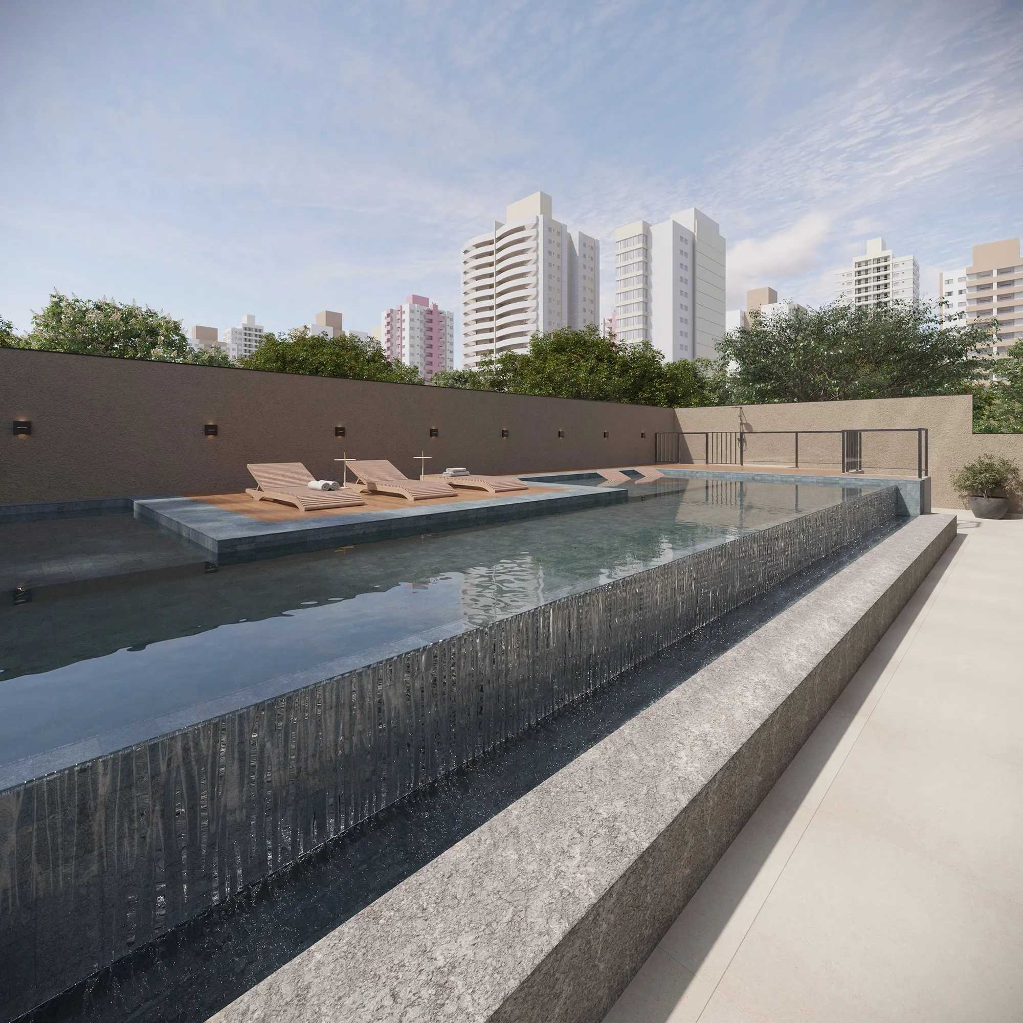 Piscina com borda infinita do Raízes Vila Ema, com espreguiçadeiras e prédios da Vila Ema ao fundo