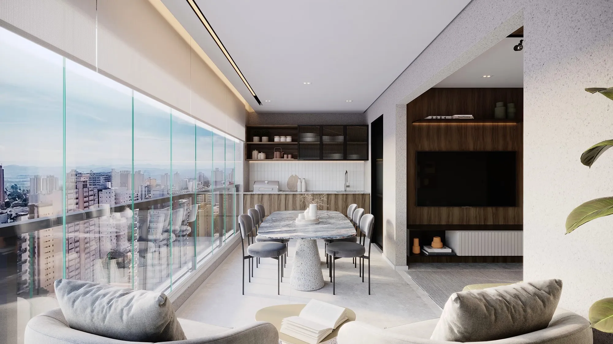 Varanda gourmet do apartamento de 75 m² do Raízes Vila Ema, com mesa e vista da cidade