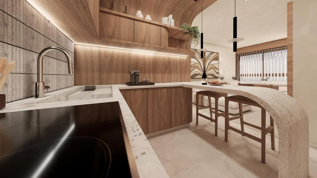 Cozinha do Úniko Vila Ema em conceito aberto, com bancada curva e banquetas