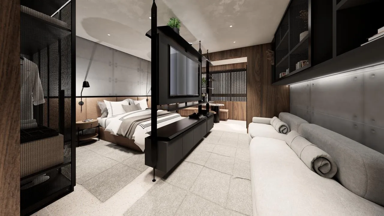 Studio do Úniko Vila Ema, com cama, estante vazada e sofá no mesmo ambiente